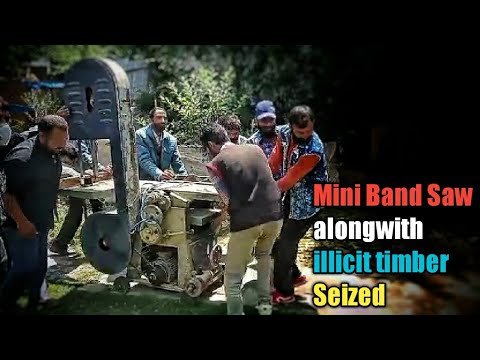 Mini Band Saw alongwith illicit timber seized in Kupwara