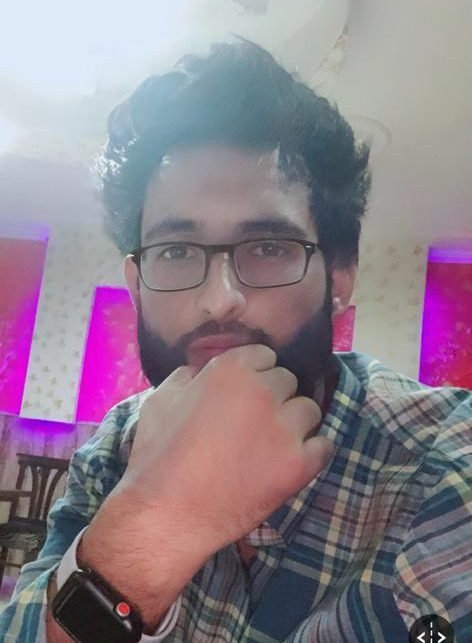 Social Activist Neehan Afzal Sufi greets people on the eve of Eid-Ul-Adha