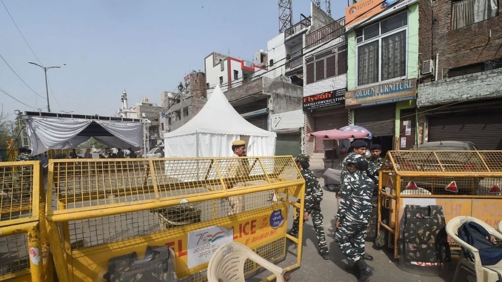 Security personnel guard in the violence-hit Jahangirpuri area, in New Delhi on Tuesday, 19 April, 2022.