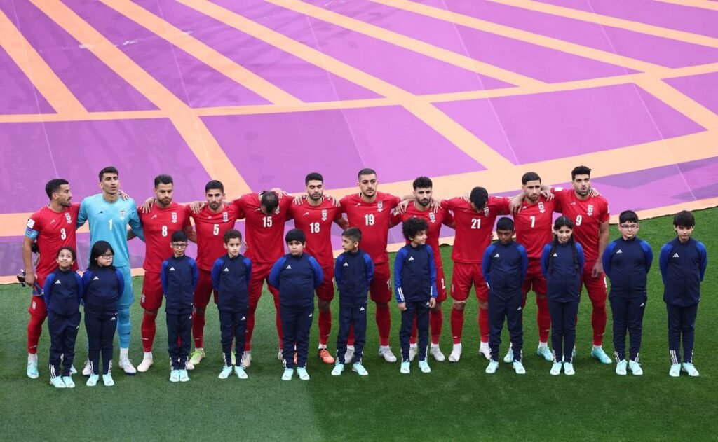 Soccer Football - FIFA World Cup Qatar 2022 - Group B - England v Iran - Khalifa International Stadium, Doha, Qatar - November 21, 2022 Iran players line up during the national anthems before the match REUTERS/Marko Djurica