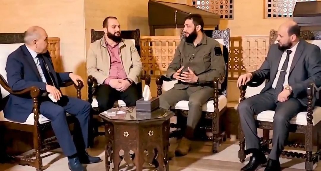 Syrian rebel leader meets ex-PM to coordinate transfer of power as parliament backs ‘people’s will’