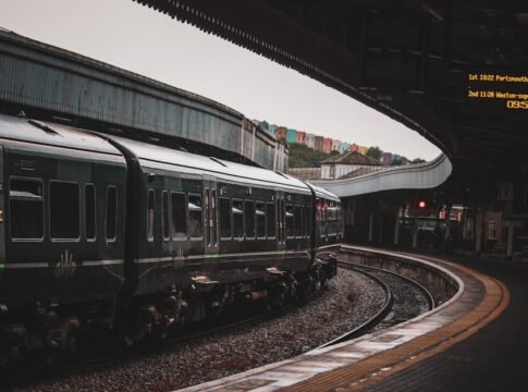 A Great Western Railway train arrives at a bustling UK station platform. Captures public transit in action. A Great Western Railway train arrives at a bustling UK station platform. Captures public transit in action.