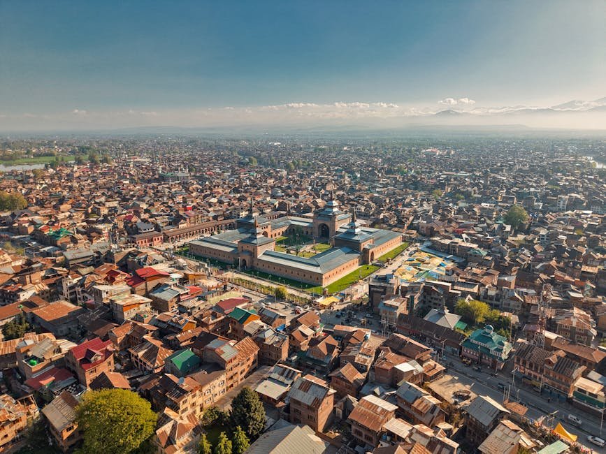 A breathtaking aerial view showcasing the iconic Jamia Masjid amidst the bustling cityscape of Srinagar.
