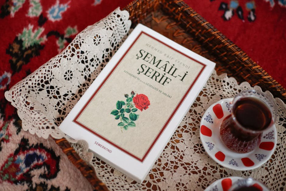 Family Alleges Child Immigrant Suffered Sexual Abuse in U.S. Custody A cozy setting featuring Turkish tea served with a Semail-i Serif book on a decorative lace tray.
