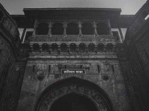 A dramatic view of the historic Shaniwar Wada Fort in Pune, showcasing its stunning architectural details.