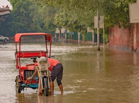 A rickshaw navigates a flooded street in New Delhi, India, during the 2023 monsoon. A rickshaw navigates a flooded street in New Delhi, India, during the 2023 monsoon.