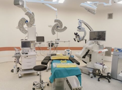 A state-of-the-art operating room fully equipped with advanced medical devices and surgical tools.