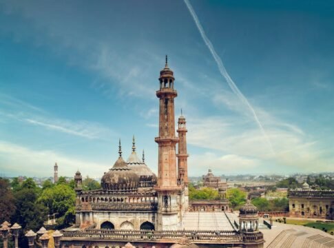 A striking view of a historic mosque with minarets in Lucknow, India, showcasing architectural beauty. A striking view of a historic mosque with minarets in Lucknow, India, showcasing architectural beauty.