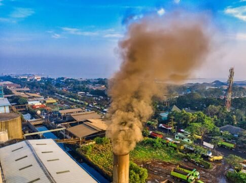 Aerial photograph showcasing air pollution from a factory in Jakarta, Indonesia.