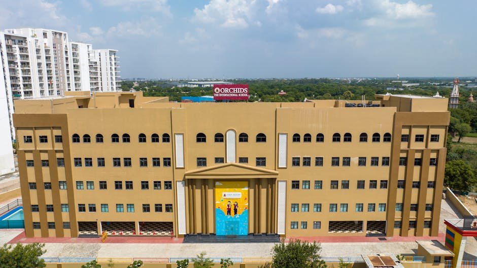Jammu and Kashmir: DPS Srinagar Organizes ‘Sustainable Tomorrow’ Cross Country Run Aerial view of a modern educational building, Orchids The International School, in India.