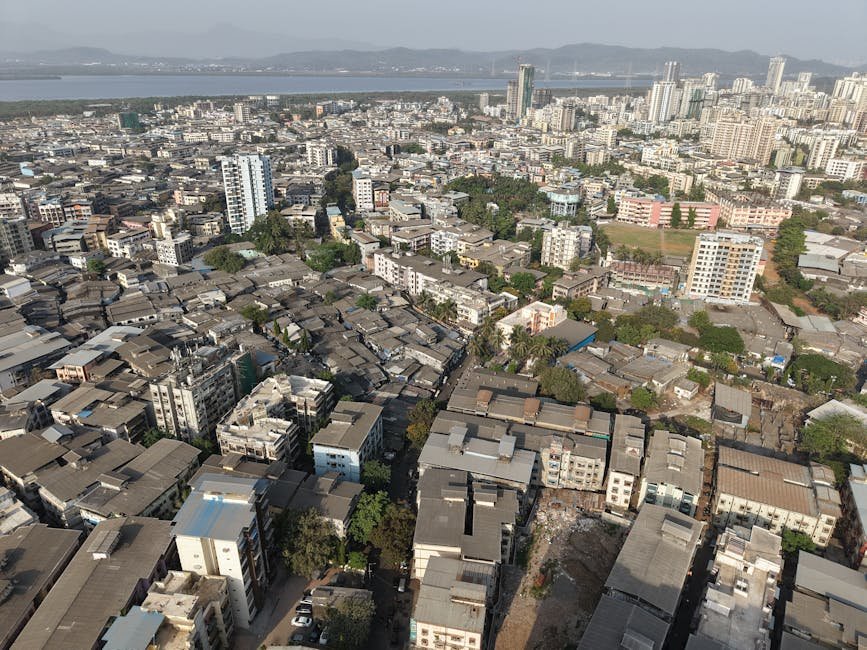 Mumbai: Final Phase of GMLR Project to Alleviate Eastern Express Highway Congestion Aerial view of the dense urban landscape of Mumbai, showcasing high-rises and residential areas.
