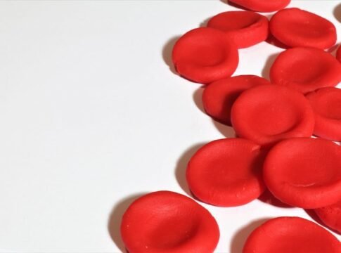 Artistic depiction of red blood cells on a white background, emphasizing medical concepts. Artistic depiction of red blood cells on a white background, emphasizing medical concepts.