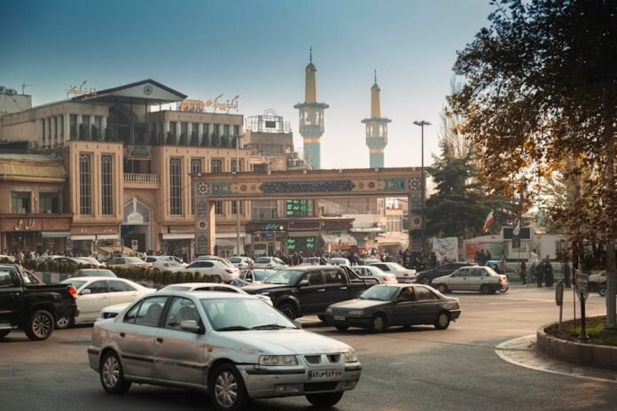 Bustling Tehran street scene with cars, mosque minarets, and traditional architecture. Bustling Tehran street scene with cars, mosque minarets, and traditional architecture.