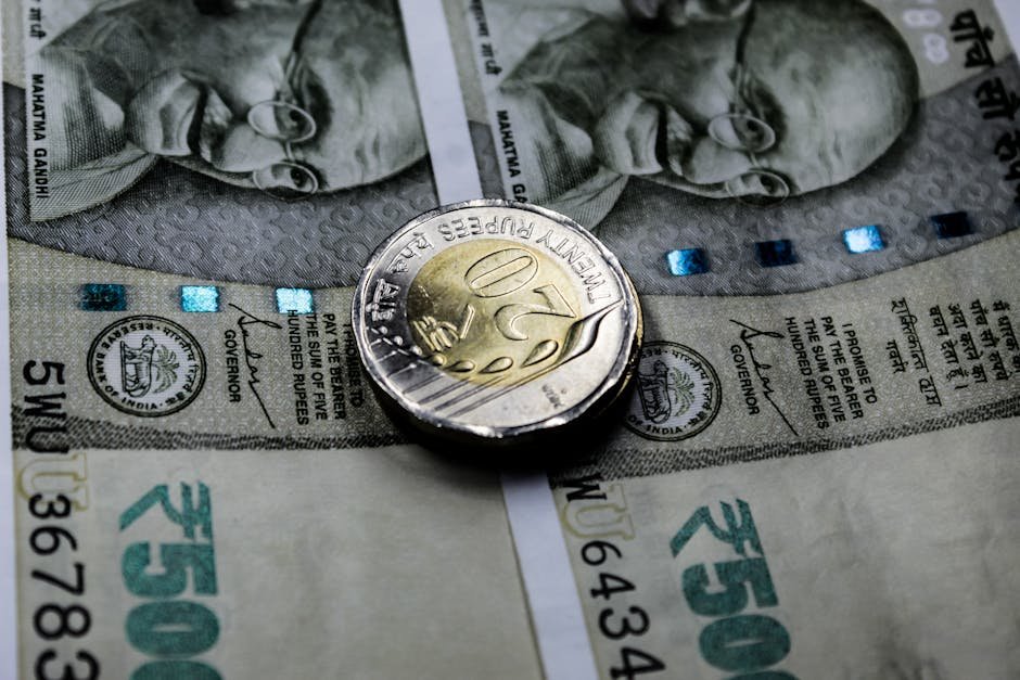 India’s USD 10 Trillion Economy Goal Hinges on Legal System Quality, Says Chief Justice of India Close-up image of Indian rupee notes with a twenty rupee coin, illustrating financial themes.