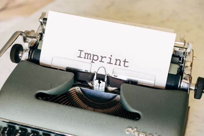 Close-up of a vintage typewriter with the word 'Imprint' on paper, evoking a classic retro feel. Close-up of a vintage typewriter with the word 'Imprint' on paper, evoking a classic retro feel.