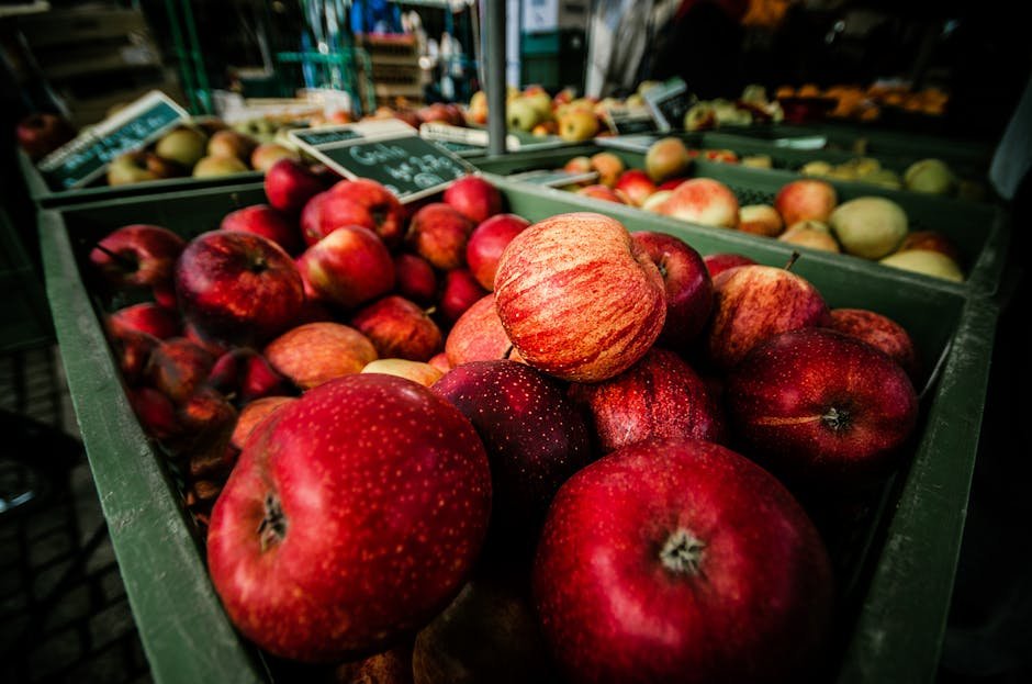 Jammu and Kashmir Apple Growers Demand Crop Insurance Ahead of Peak Season Close-up of fresh red apples at a market stall in Ludwigsburg, Germany showcasing abundance and freshness.