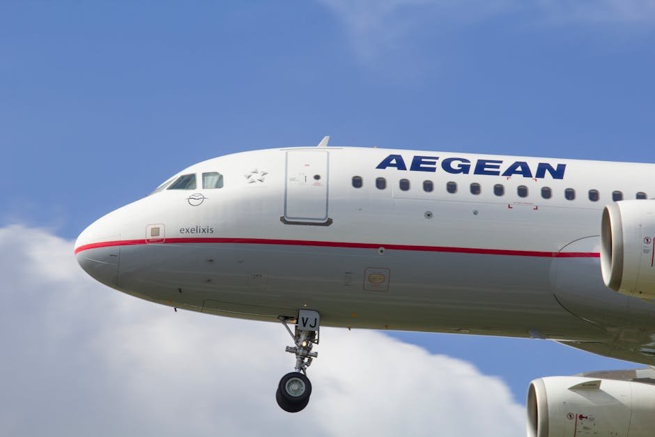 European Airlines Face Imminent Jet Fuel Shortage Amid Strait of Hormuz Blockade Close-up view of an Aegean Airlines Airbus A321 plane in flight against a bright sky.