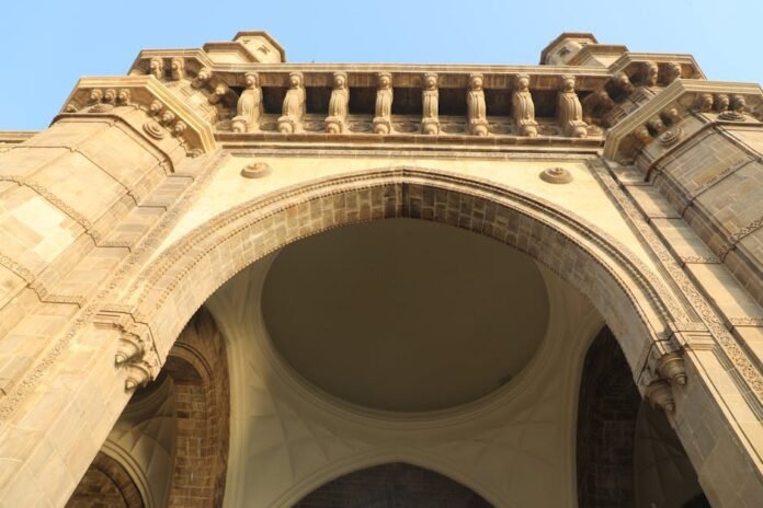 Detailed view of the Gateway of India archway in Mumbai, showcasing its architectural grandeur.