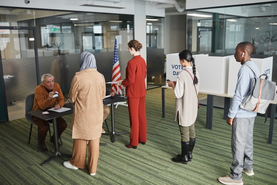 Diverse group of voters lining up at an indoor polling station on election day.