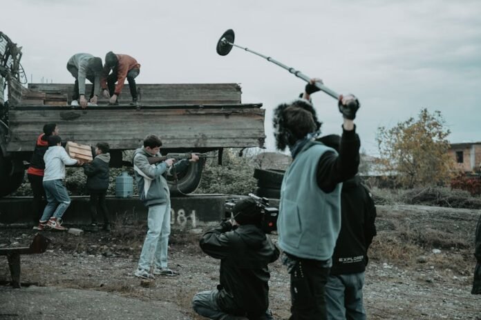 Film crew working outdoors, capturing scenes with camera and boom mic. Film crew working outdoors, capturing scenes with camera and boom mic.