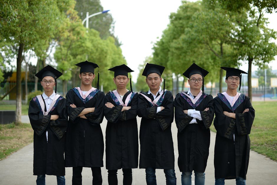 Maharashtra: Pune Aspirants Face Financial Strain as LPG Prices Hike Mess Bills Group of young graduates in gowns and caps standing outdoors, celebrating academic achievement.