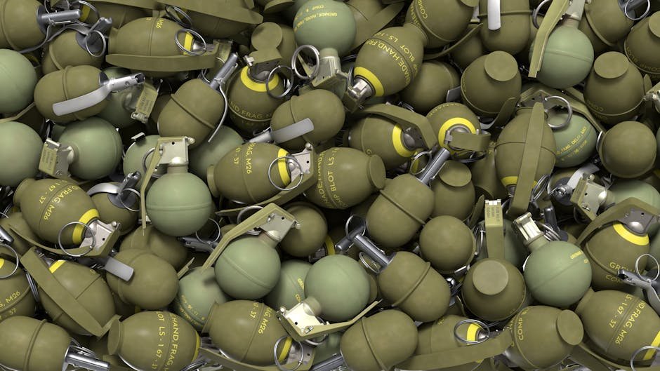 Jammu and Kashmir: Security Forces Discover Two Rusted Grenades in Rajouri District High-resolution image of olive green military hand grenades in a pile, showcasing industrial design.