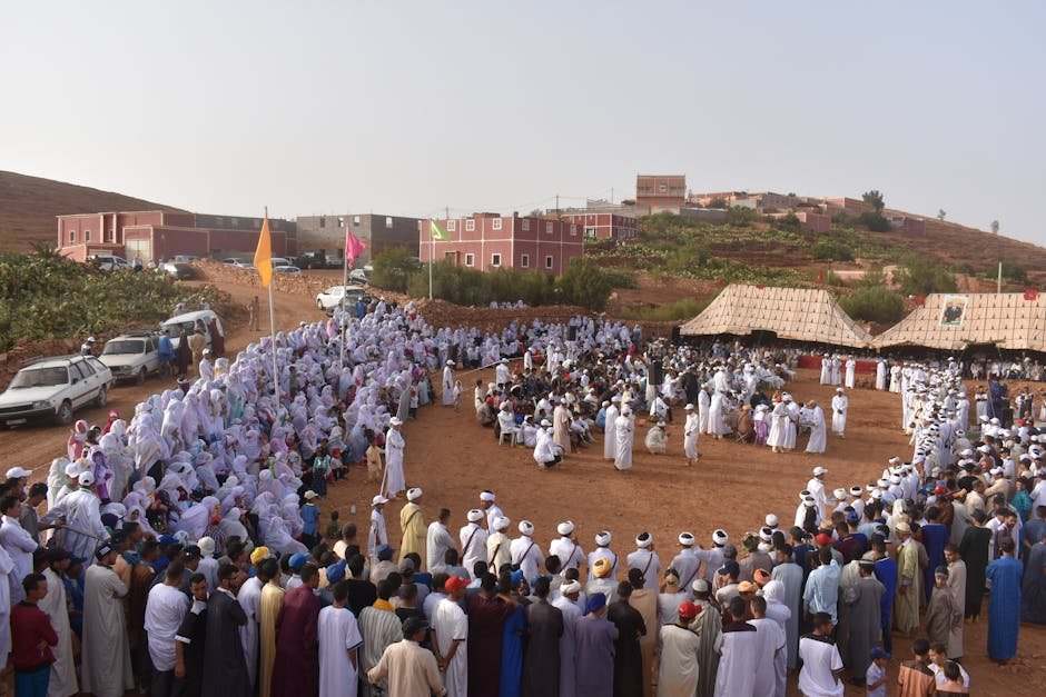 Uttar Pradesh Parties Vie for Nishad Community Votes Ahead of 2027 Elections Large outdoor gathering in a Moroccan village, showcasing cultural and traditional attire.