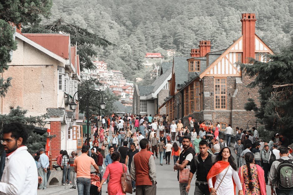 Himachal Pradesh University Invites Applications for Postgraduate Courses; Deadline April 24 Lively crowd on a street in Shimla, India, surrounded by historic architecture and scenic hills.