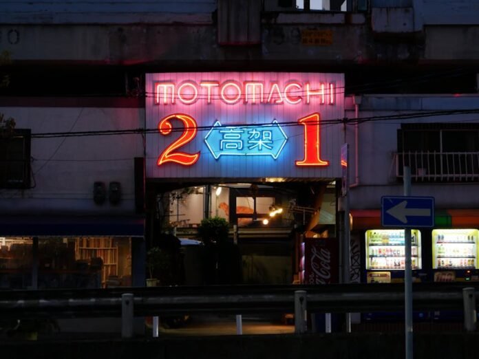 Neon-lit entrance in Kobe, Japan, showcasing vibrant street ambiance at night. Neon-lit entrance in Kobe, Japan, showcasing vibrant street ambiance at night.