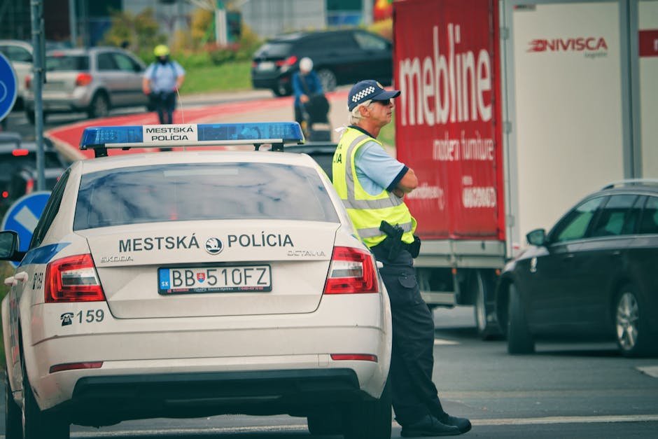 Jammu Kashmir Police Officers Deputed for Hajj Duties in Saudi Arabia Police officer managing traffic on a city street in Slovakia.