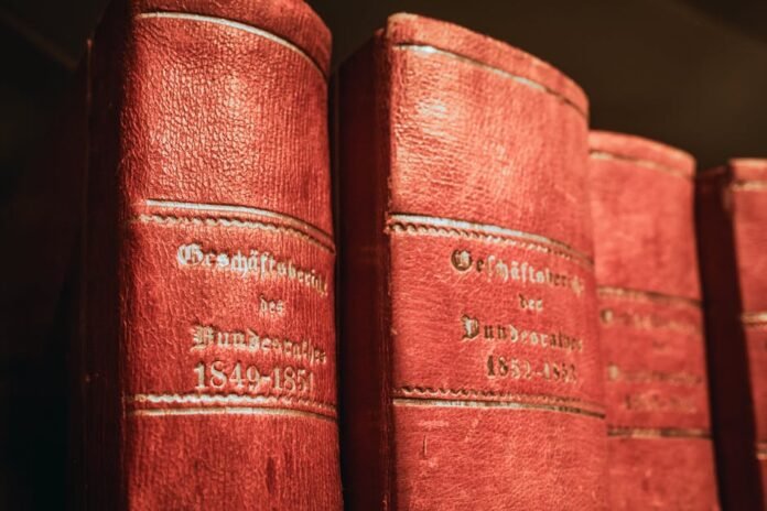 Red leather-bound parliamentary books from 19th century in Bern library, Switzerland.