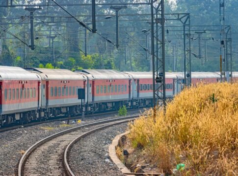 Scenic view of an Indian Railways passenger train passing through Karnataka, India.