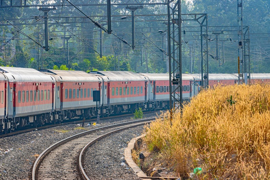 Scenic view of an Indian Railways passenger train passing through Karnataka, India.