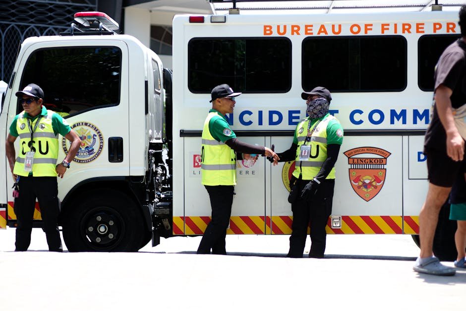 Pune Municipal Corporation to Appoint Incident Commandant for Emergency Management Security officers in safety vests beside an emergency response vehicle.