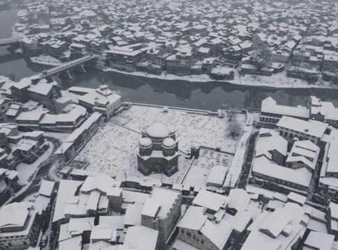 Snow blankets the historic buildings of Srinagar, showcasing its unique winter charm from above. Snow blankets the historic buildings of Srinagar, showcasing its unique winter charm from above.