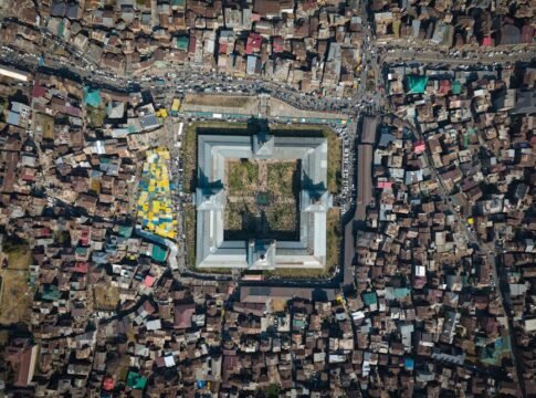Stunning aerial shot of Jamia Masjid in Srinagar, showcasing its distinct architecture and surrounding urban landscape.