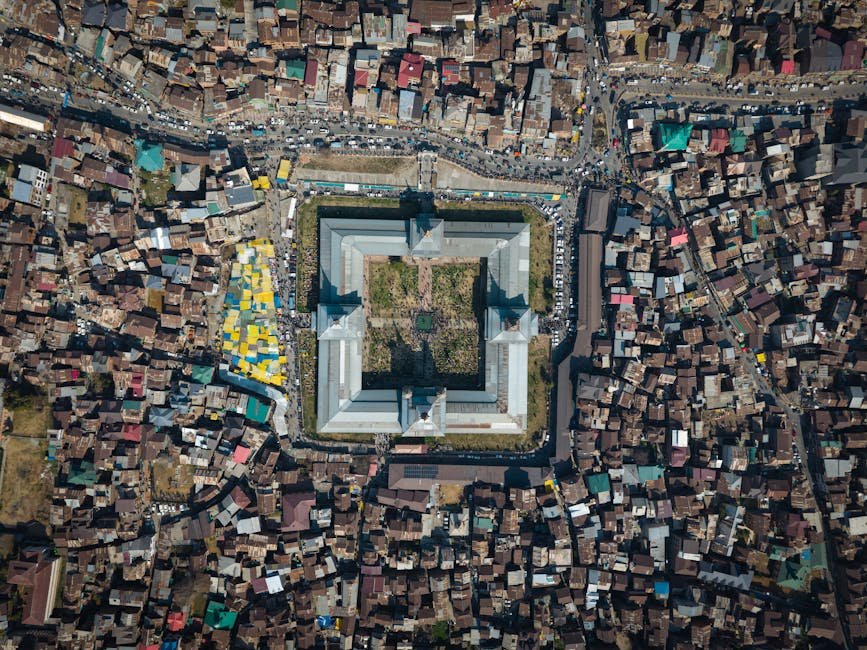Jammu and Kashmir Tourism Thrives Amid Government Action on Overcharging Complaints Stunning aerial shot of Jamia Masjid in Srinagar, showcasing its distinct architecture and surrounding urban landscape.