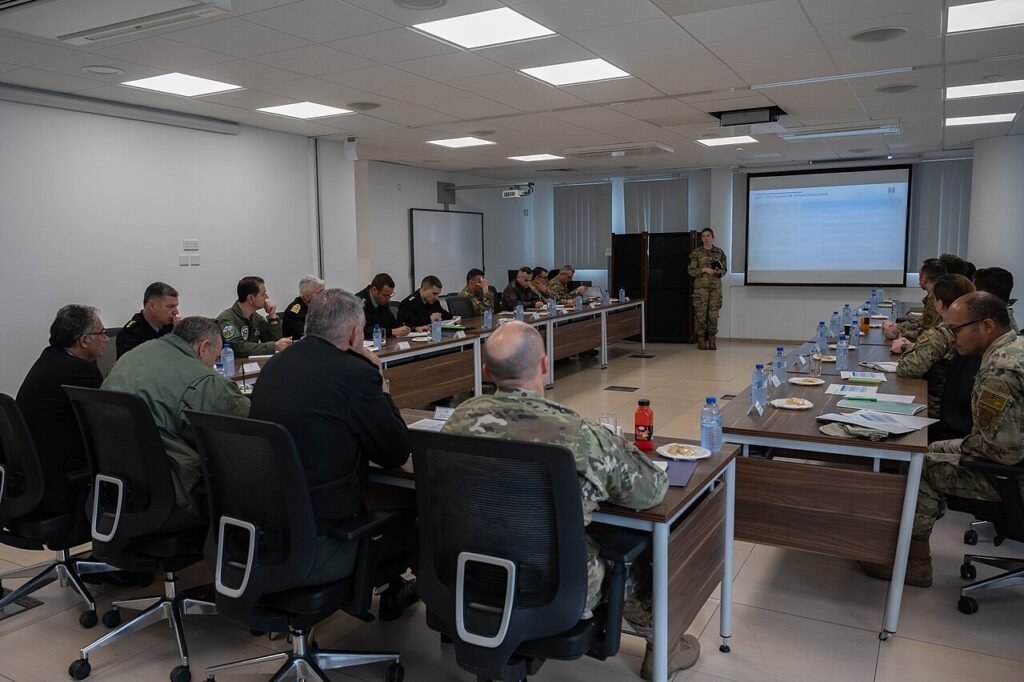 U.S. Air Force 1st Lt. Virginia Walsh, 435th Contingency Response Support Squadron flight commander and logistics readiness air advisor, provides a final briefing to U.S. Army COL. Kenneth “K.C.” Eva…