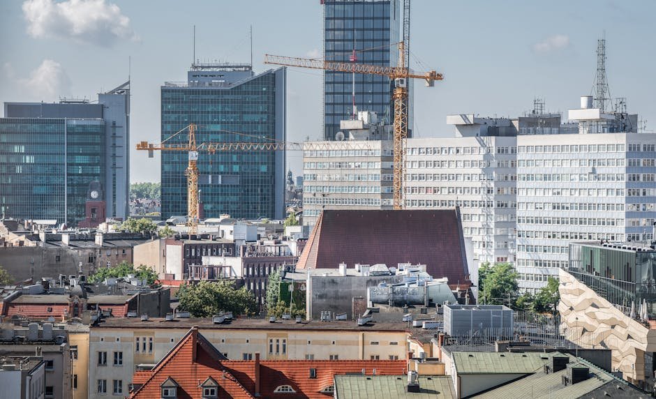 Maharashtra plans green building norms to combat rising heat, targets net-zero by 2050 Urban skyline of Poznań with cranes and modern architecture in view.