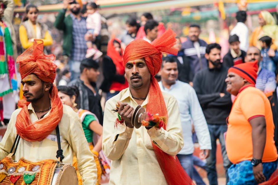 India Rejects China’s Fictitious Names for Arunachal Pradesh Places Vibrant street festival in India featuring traditional musicians in colorful attire.