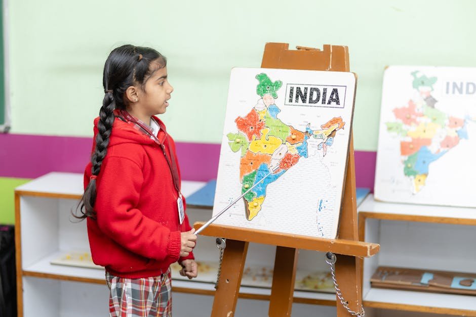 Indian Knowledge Systems Highlighted in Interactive Session Under Sadhana Saptah Young student points to India map in a classroom, fostering education.