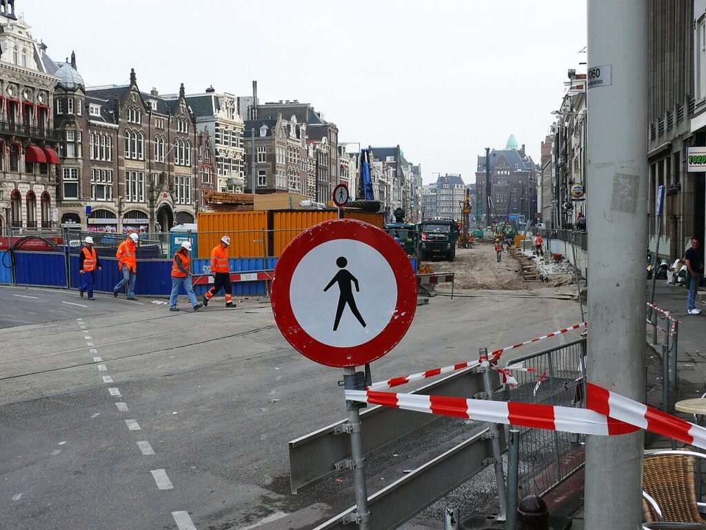 2007 - a break for the construction workers at the Rokin at the building site of the future metro station underground of the North-South line under the old city. The big sign tells: forbidden area fo…