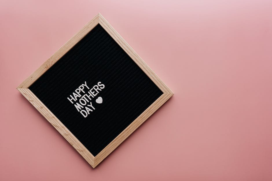 Ideas to Make Mother’s Day Memorable A black letter board with 'Happy Mother's Day' on a pink background, perfect for celebrations.