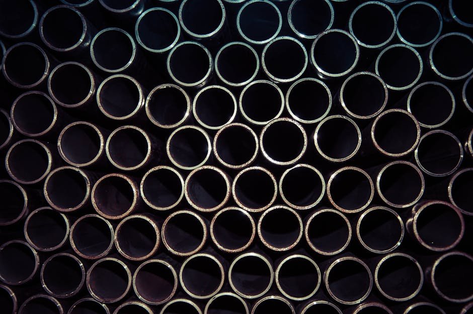 Haryana Government and Jindal Stainless Renew Partnership for Skill Development in Stainless Steel Applications A detailed macro shot of stacked metal tubes forming a circular pattern, highlighting industrial design.