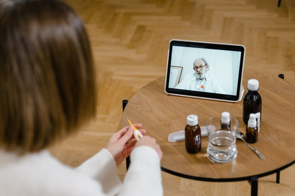 Phagwara Chemists Join Nationwide Strike Against Online Medicine Sales A doctor provides an online consultation via video call on a tablet, seen on a wooden table.