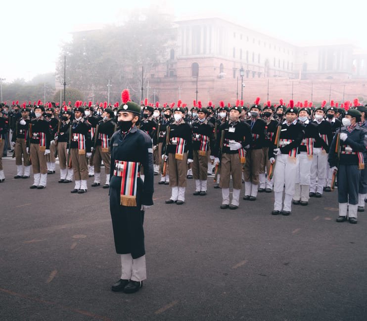 Delhi Gears Up for Major Road Corridor Redevelopment to Combat Dust and Enhance Public Spaces A large group of soldiers in uniform standing in formation during a military parade outdoors.