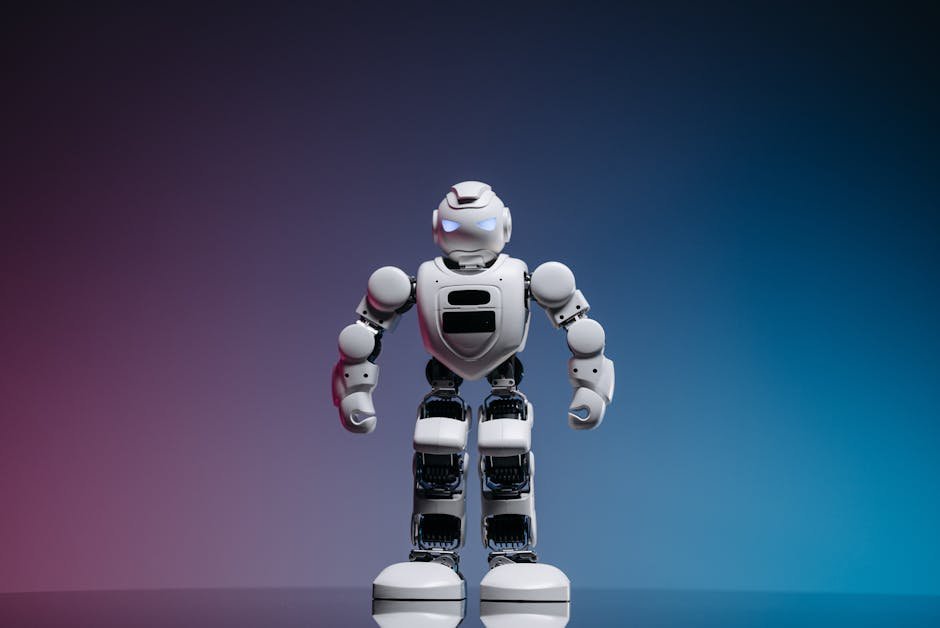 AI-Assisted Kannada Translation Marks Publishing Milestone in Mysuru A modern toy robot standing on a gradient background, showcasing innovation and technology.