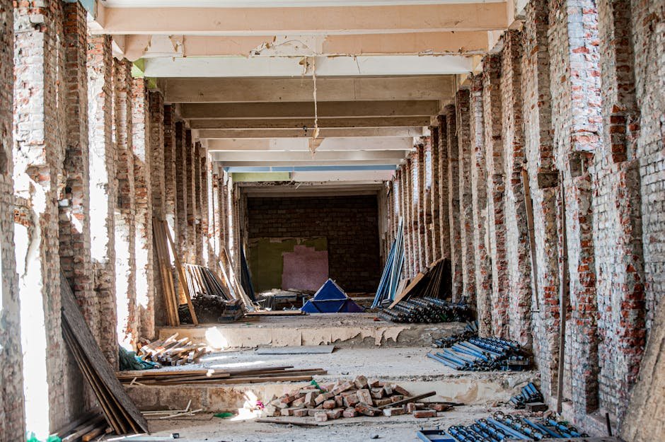 Mumbai Metropolitan Region’s Airoli-Katai Corridor Nears Completion, Promising Significant Travel Time Reduction An empty industrial interior undergoing renovation, with exposed brick and construction materials.