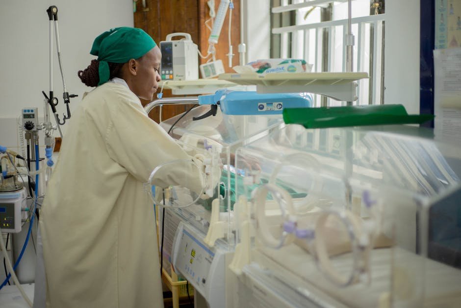 Jammu & Kashmir: Amandeep BR Medicity NICU Discharges Over 200 Critically Ill Newborns Doctor attending to newborns in an incubator in a hospital neonatal unit.