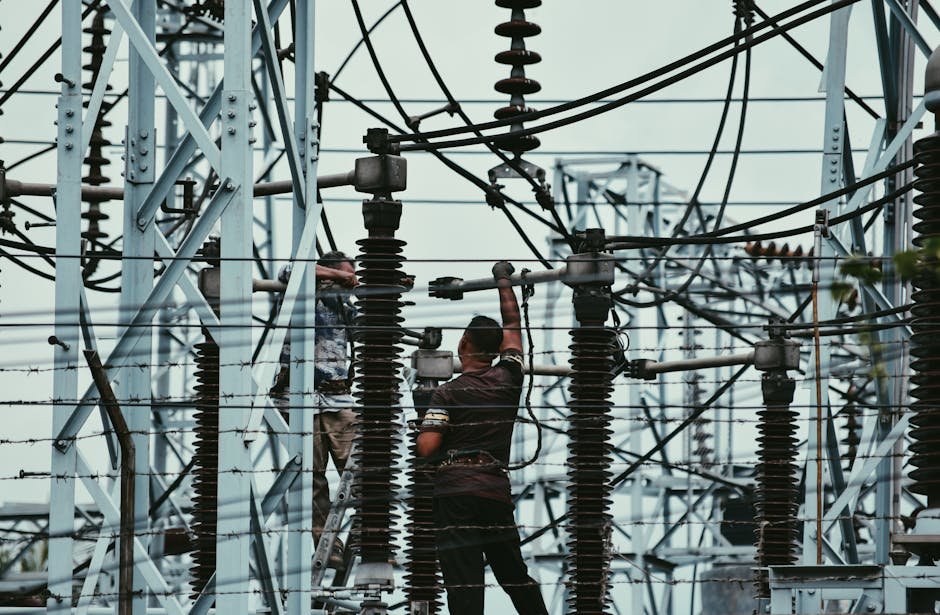 Uttar Pradesh Faces Uproar Over 10% Fuel Surcharge on Electricity Bills Electricians working on power lines, ensuring grid maintenance and safety.